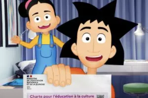Image of Vinz holding a charter on digital citizenship with Lou behind him 