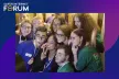 A group of young people smiling in front of the photo booth
