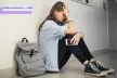 Teenage girl with a smartphone in her hand upset about cyberbullying