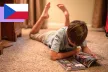 A child reading a comic book.