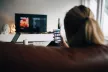 Young girl from behind looking at her smartphone.