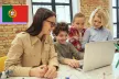 Digital literacy. Kids learn using laptop with teacher.