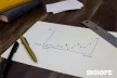 A graph on a piece of paper and two pens
