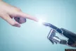 Robotic hand touching human hand