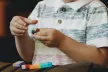 Young child playing with building blocks