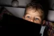 Boy looking at his laptop