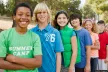 A group of children at summer camp smiling.