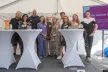 Group of young picture at a convention smiling for the camera