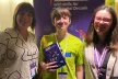 Youth Panel in front of a conference banner
