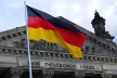 View of the Brandenburgen Tor with an overlapping German flag
