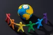 little men holding hands with the globe in the middle