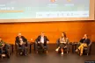 People sitting in a room in a conference