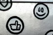 Emoji-style symbols painted on a wall