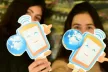Greek students holding images of the SID mascot