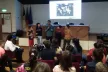 João presenting at the event in front of a school class