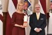 Maija Katkovska, the head of the Latvian Safer Internet Centre, receiving the cross from the President of Latvia