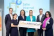Austrian Safer Internet Staff standing in front of a screen showing the Safer Internet Day logo