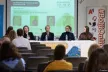 A picture of the forum venue during a panel discussion with four panellists