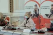Two women and one man sitting behind a table at a Safer Internet Day event