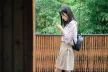 Teenage girl using a mobile device in an outside setting