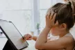 Young girl playing on iPad