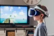Kid using VR goggles in his living room