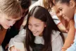 Young people looking at a mobile phone screen