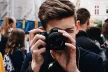 Boy filming a video on a camera