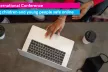 Person browsing laptop on table