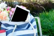 Tablet in a bag on a park bench