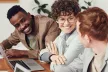 Group of smiling young people with laptops