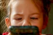 Little girl with phone in her hands