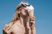 Woman Eating Melting Ice Cream