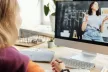 Girl following an online lesson on a desktop computer