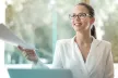 Woman receiving a paper document