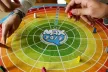 Picture of the board used for the game Max 24/7, looking like a target with a colour progression going from red to green.