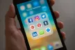 Social media platform icons shown on a phone screen