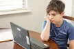 Child looking at laptop
