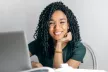 Smiling woman working on a laptop