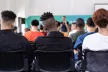 A group of high school students sitting in their classroom