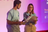 Young people are on the stage presenting