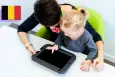 A mother and her toddler daughter playing on a tablet