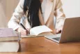 Desktop view of a laptop and notebook