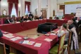 People sitting around a table at a conference