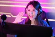 Girl in a streaming setting greeting the camera