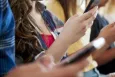 Young people holding their phone