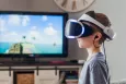Kid using VR goggles in his living room