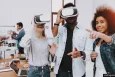 A group of three young people using VR headsets