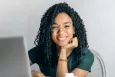Smiling woman using a laptop
