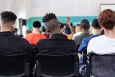 A group of high school students sitting in their classroom
